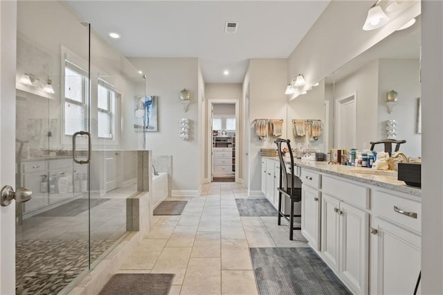 bathroom featuring a garden tub, visible vents, a shower stall, vanity, and recessed lighting