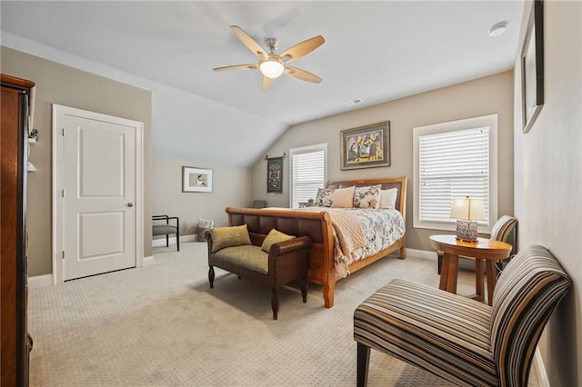 bedroom featuring baseboards, ceiling fan, vaulted ceiling, and light colored carpet