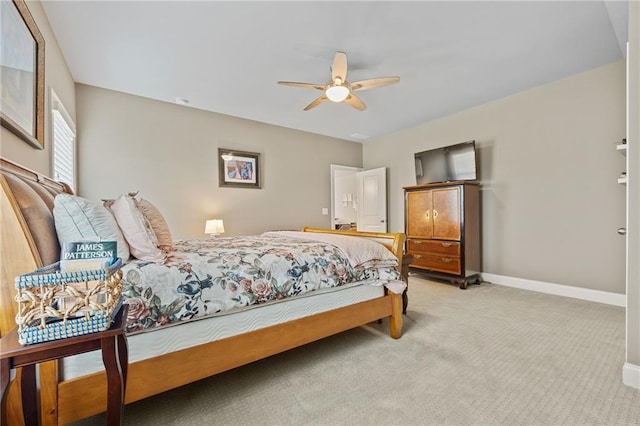 bedroom featuring carpet floors, baseboards, and a ceiling fan