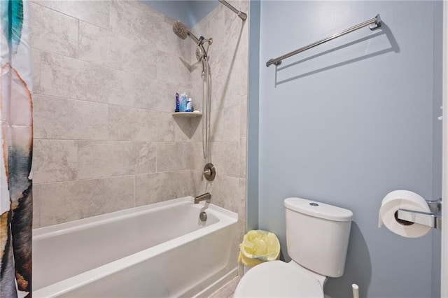 bathroom featuring shower / bath combo with shower curtain and toilet
