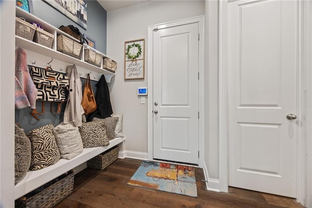 mudroom with baseboards and dark wood finished floors