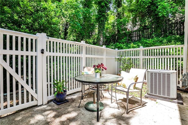 1750 Clairmont Rd Unit 35, Decatur, GA 30033 - view of patio / terrace featuring central AC and outdoor dining area