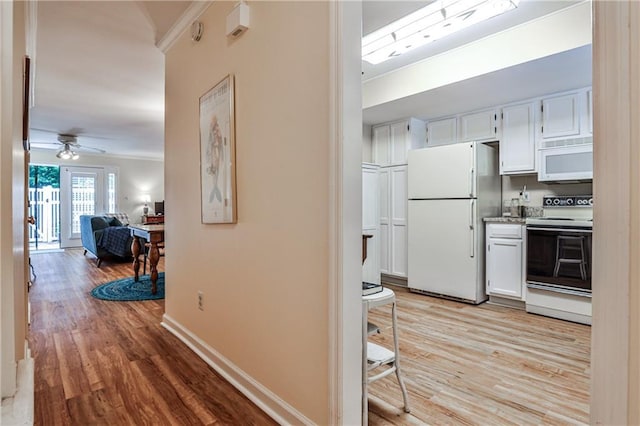 1750 Clairmont Rd Unit 35, Decatur, GA 30033 - hallway featuring ornamental molding, light wood finished floors, and baseboards