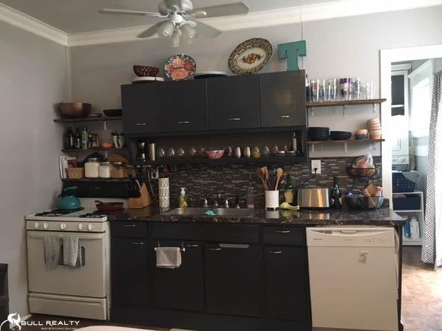 kitchen with white appliances, backsplash, sink, crown molding, and ceiling fan