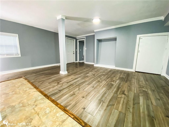 interior space featuring wood-type flooring and crown molding