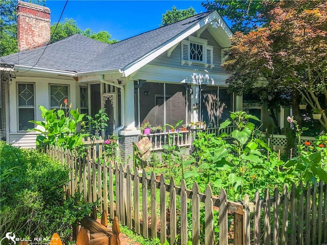 view of side of property with a sunroom