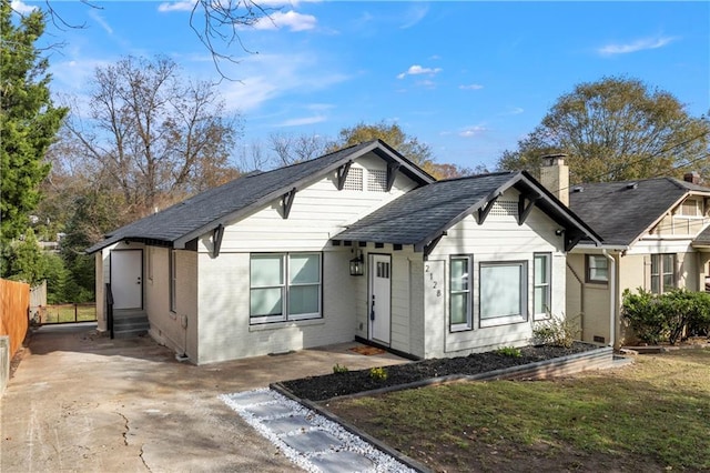 2128 Hosea L Williams Dr NE, Atlanta, GA 30317 - view of front of home featuring entry steps, brick siding, and a chimney