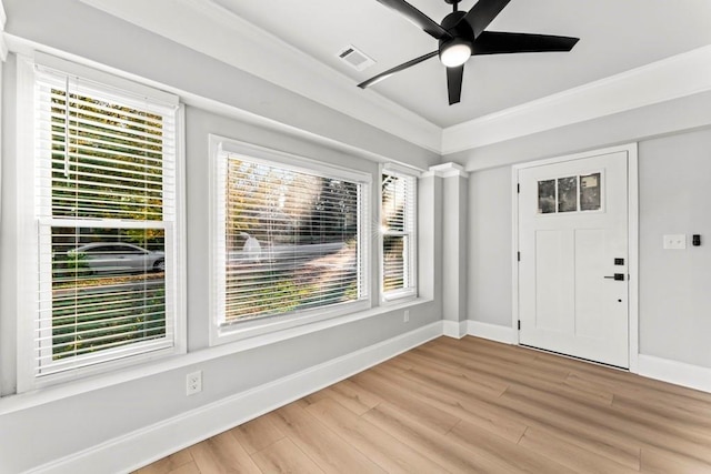 2128 Hosea L Williams Dr NE, Atlanta, GA 30317 - foyer with healthy amount of natural light, light wood-type flooring, ceiling fan, and ornamental molding