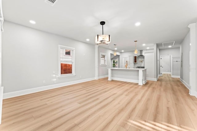 2128 Hosea L Williams Dr NE, Atlanta, GA 30317 - unfurnished living room featuring attic access, light wood-type flooring, and recessed lighting