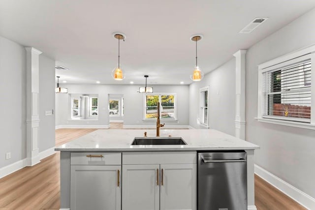 2128 Hosea L Williams Dr NE, Atlanta, GA 30317 - kitchen featuring open floor plan, light wood-style floors, decorative light fixtures, light stone countertops, and recessed lighting