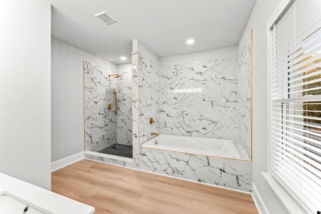 2128 Hosea L Williams Dr NE, Atlanta, GA 30317 - full bathroom with a marble finish shower, a bath, plenty of natural light, wood finished floors, and recessed lighting
