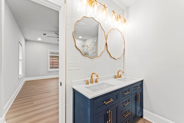2128 Hosea L Williams Dr NE, Atlanta, GA 30317 - full bathroom with double vanity and wood finished floors