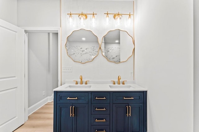 2128 Hosea L Williams Dr NE, Atlanta, GA 30317 - bathroom featuring double vanity and wood finished floors