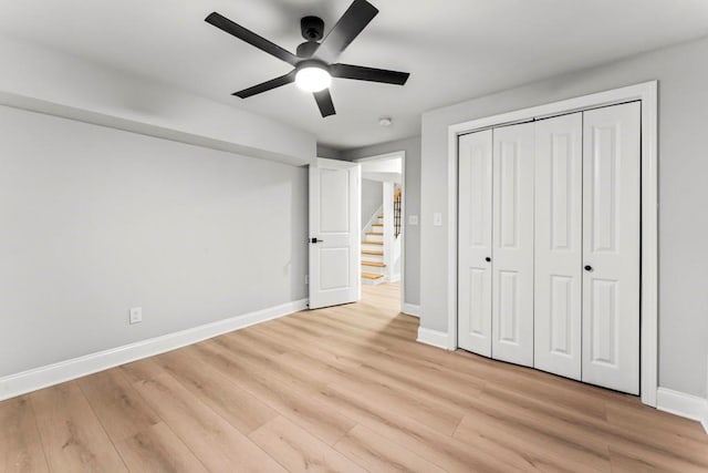 2128 Hosea L Williams Dr NE, Atlanta, GA 30317 - unfurnished bedroom with light wood finished floors and a ceiling fan