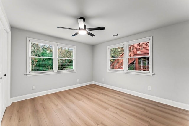 2128 Hosea L Williams Dr NE, Atlanta, GA 30317 - spare room featuring light wood-type flooring, healthy amount of natural light, and ceiling fan