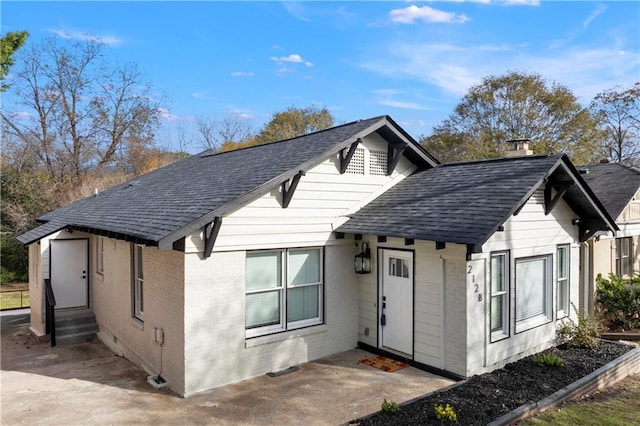 2128 Hosea L Williams Dr NE, Atlanta, GA 30317 - view of front facade featuring roof with shingles and brick siding