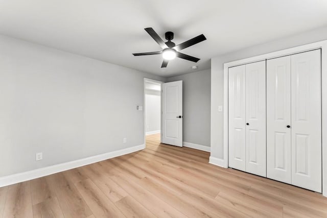 2128 Hosea L Williams Dr NE, Atlanta, GA 30317 - unfurnished bedroom with light wood finished floors, a closet, and a ceiling fan