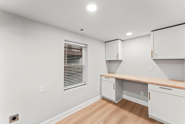2128 Hosea L Williams Dr NE, Atlanta, GA 30317 - unfurnished office featuring built in desk, light wood-type flooring, and recessed lighting