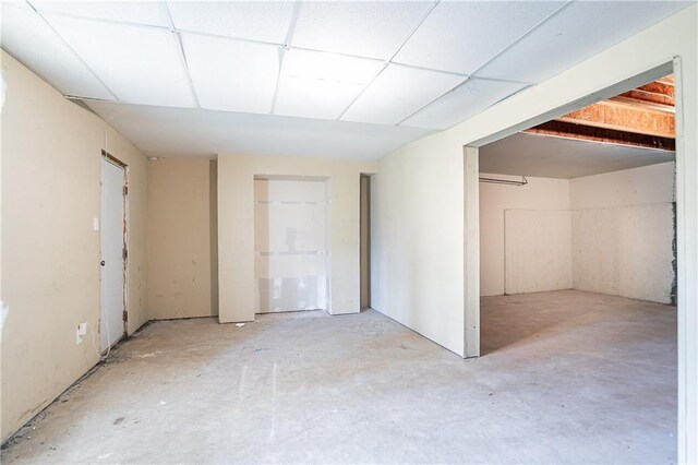 basement featuring a drop ceiling