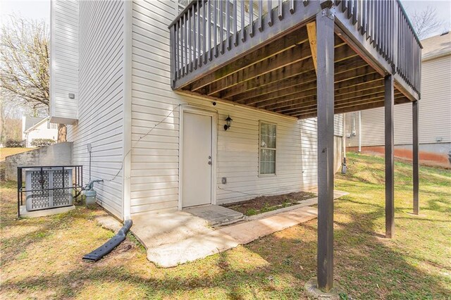 doorway to property featuring a yard