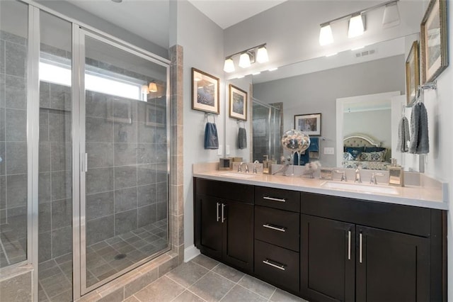 bathroom with vanity, tile patterned floors, and a shower with shower door