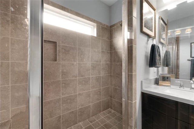 bathroom featuring vanity and a tile shower