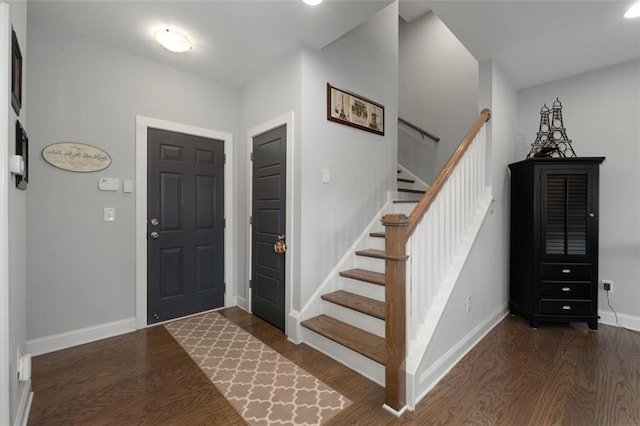 entrance foyer with dark hardwood / wood-style flooring