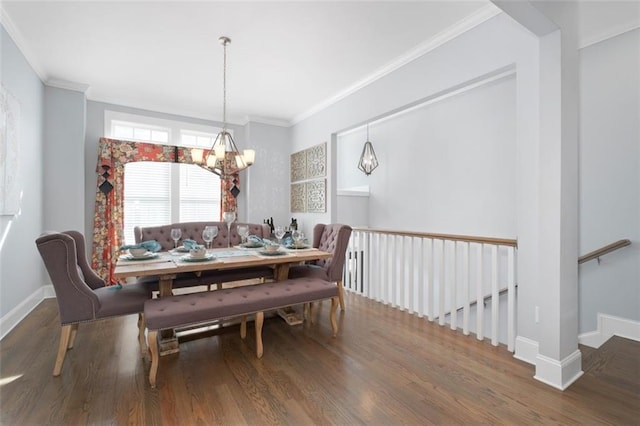 dining room featuring crown molding, a chandelier, and hardwood / wood-style floors