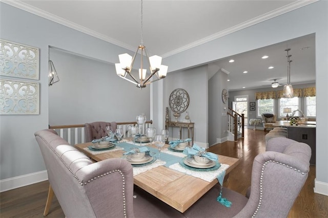 dining room featuring crown molding, dark hardwood / wood-style flooring, and ceiling fan with notable chandelier