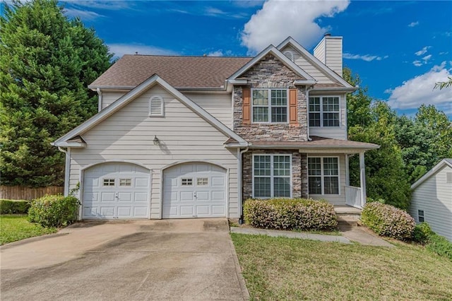 view of front of home featuring a garage and a front lawn