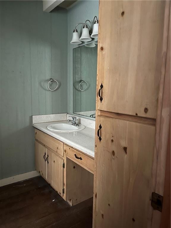 bathroom with vanity and wood-type flooring