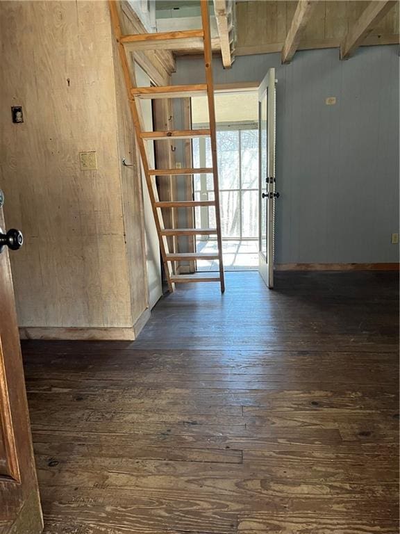 unfurnished room featuring dark hardwood / wood-style flooring