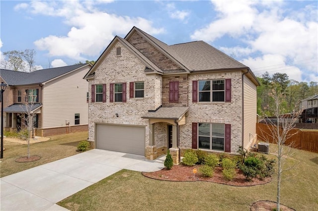 509 Azalea Bloom Dr, Loganville, GA 30052 - view of front facade featuring a garage, a front lawn, fence, brick siding, and concrete driveway