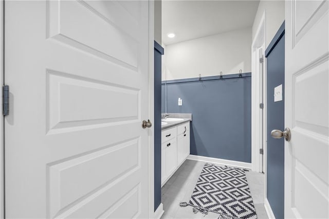 509 Azalea Bloom Dr, Loganville, GA 30052 - bathroom with recessed lighting, baseboards, tile patterned flooring, and vanity