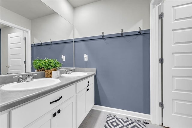 509 Azalea Bloom Dr, Loganville, GA 30052 - full bathroom with double vanity, baseboards, a sink, and tile patterned flooring