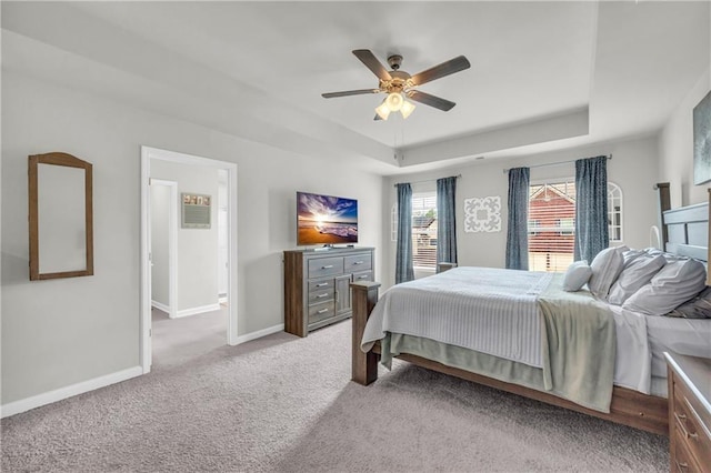509 Azalea Bloom Dr, Loganville, GA 30052 - bedroom with a raised ceiling, baseboards, light carpet, and a ceiling fan
