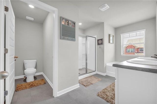 509 Azalea Bloom Dr, Loganville, GA 30052 - full bath with baseboards, recessed lighting, a stall shower, and toilet