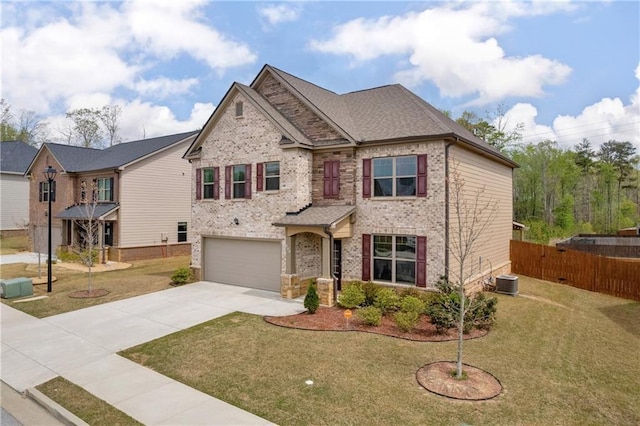 509 Azalea Bloom Dr, Loganville, GA 30052 - view of front of house with brick siding, driveway, a front yard, and a garage