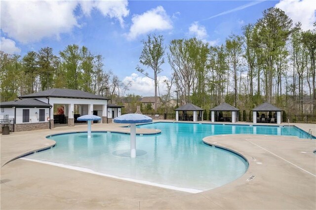 509 Azalea Bloom Dr, Loganville, GA 30052 - pool with fence, a gazebo, and a patio area
