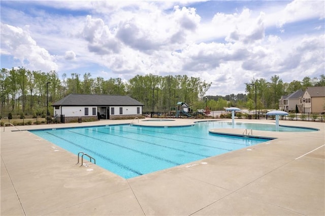 509 Azalea Bloom Dr, Loganville, GA 30052 - pool featuring fence, a patio, and playground community