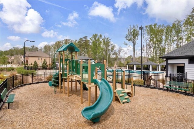 509 Azalea Bloom Dr, Loganville, GA 30052 - communal playground featuring fence