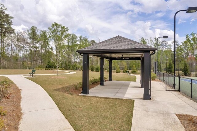 509 Azalea Bloom Dr, Loganville, GA 30052 - surrounding community with fence, a gazebo, and a lawn