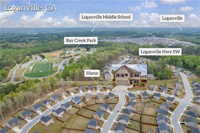 509 Azalea Bloom Dr, Loganville, GA 30052 - birds eye view of property featuring a view of trees and a residential view