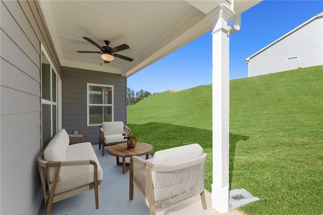 view of patio featuring ceiling fan