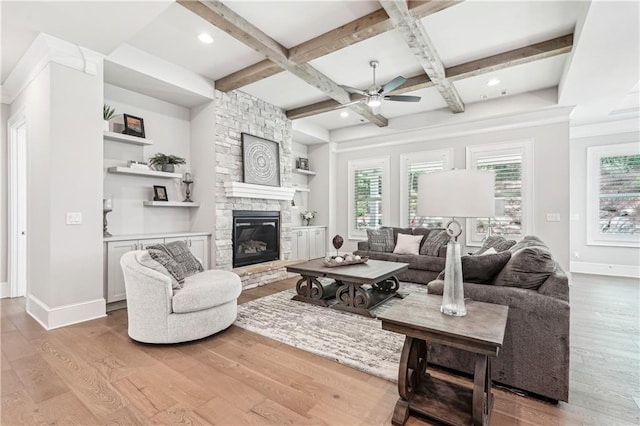 4025 Connolly Ct, Roswell, GA 30075 - living room featuring ceiling fan, baseboards, coffered ceiling, wood finished floors, and a stone fireplace