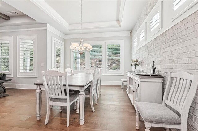 4025 Connolly Ct, Roswell, GA 30075 - dining room with a tray ceiling, healthy amount of natural light, light wood-style floors, baseboards, and crown molding