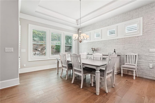 4025 Connolly Ct, Roswell, GA 30075 - dining area with a tray ceiling, a chandelier, ornamental molding, light wood finished floors, and baseboards