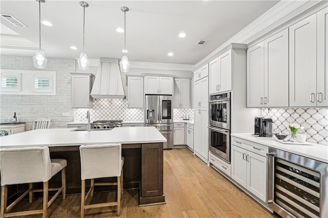 4025 Connolly Ct, Roswell, GA 30075 - kitchen with stainless steel appliances, beverage cooler, custom range hood, tasteful backsplash, and light countertops