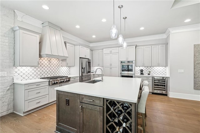 4025 Connolly Ct, Roswell, GA 30075 - kitchen featuring wine cooler, appliances with stainless steel finishes, a sink, custom range hood, and light countertops
