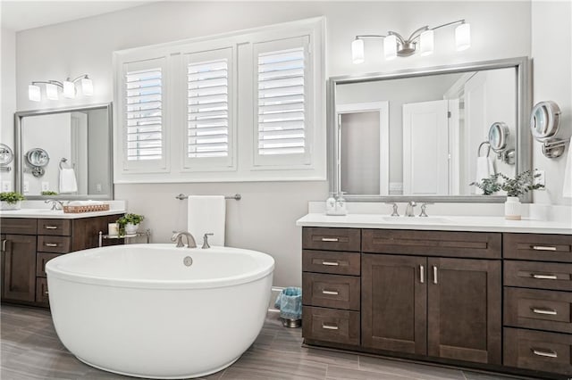 4025 Connolly Ct, Roswell, GA 30075 - bathroom with a soaking tub, two vanities, and plenty of natural light